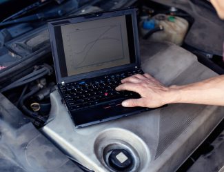 Car Mechanic With Laptop